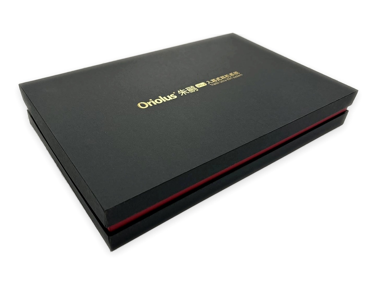 Closed black rigid paper box with red side detail and gold logo